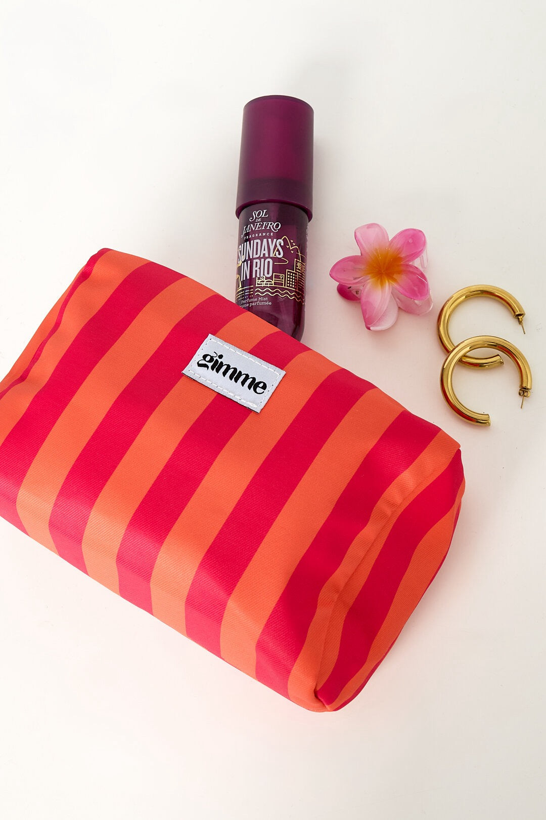 Trousse de maquillage rayée rouge et orange avec accessoires
